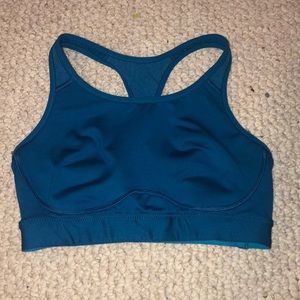 Blue sports bra with mesh on the back